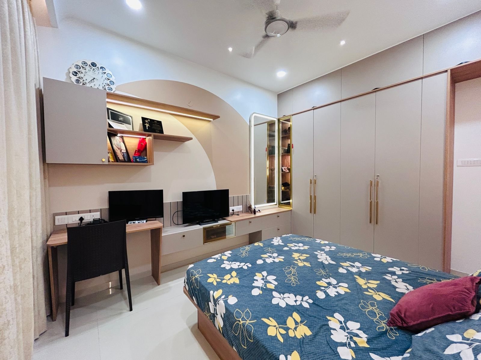 Bedroom interior with integrated storage and clean cabinetry by Doric & Co. Pune